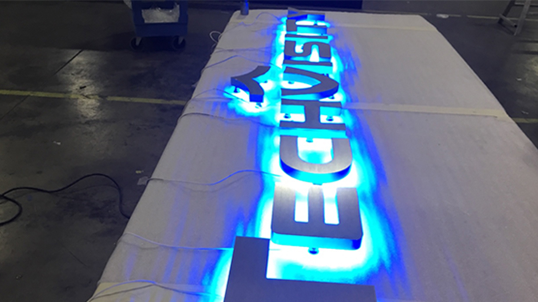 Techvisity LED light building sign laying on factory floor getting ready for shipment