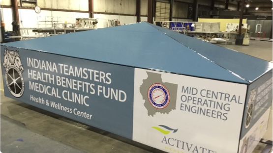 Indiana Teamsters Health Benefits Fund Medical Clinic building sign laying on factory floor getting ready for shipment